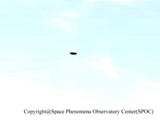 The Perfect Ellipse: Robotic Observatory Captures a Flawless, Two-Toned UFO Over Tokyo Bay